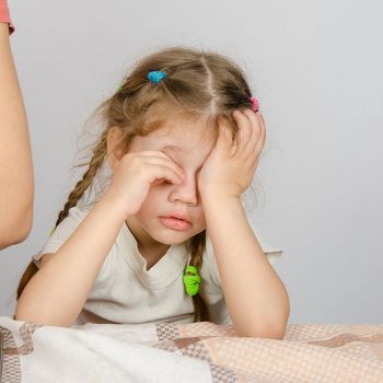 Children with sleep apnea have trouble sleeping and can be irritable and drowsy during the day.